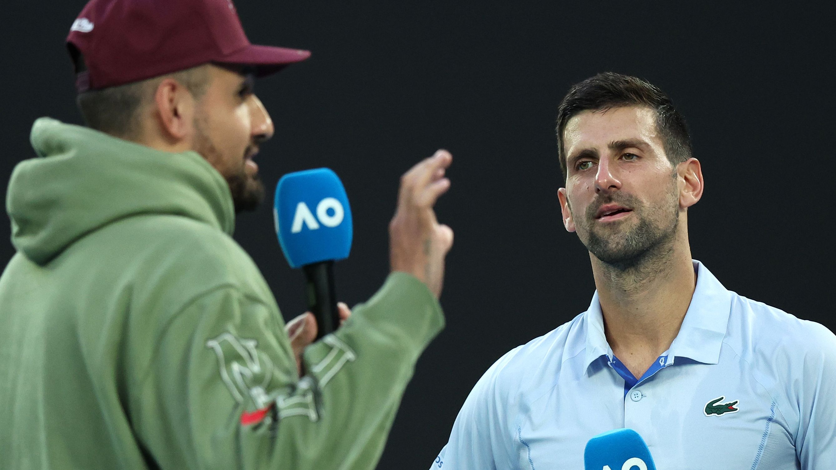 Novak Djokovic is interviewed by Nick Kyrgios after the quarter-final match against Taylor Fritz.