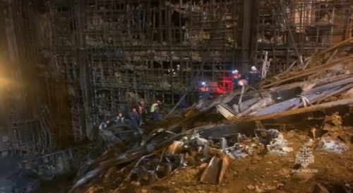 In this photo taken from video released by Russian Emergency Ministry Press Service on Tuesday, March 26, 2024, rescuers work in the burned concert hall after a terrorists attack on the building of the Crocus City Hall on the western edge of Moscow, Russia. 