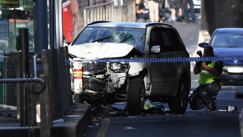 Nineteen people were injured when the car ploughed through a pedestrian crossing. (AAP)