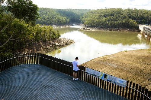 A man stands on  the viewing platform of Warragamba Dam on February 10, 2020 in Sydney, Australia.