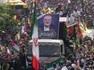 Iranians follow a truck, center, carrying the coffins of Hamas leader Ismail Haniyeh and his bodyguard who were killed in an assassination blamed on Israel on Wednesday, during their funeral ceremony at Enqelab-e-Eslami (Islamic Revolution) Sq. in Tehran, Iran, Thursday, Aug. 1, 2024. (AP Photo/Vahid Salemi)
