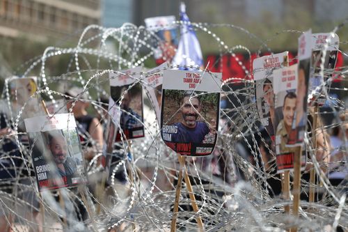Pictures of Israeli hostages held in Gaza during a demonstration outside the Kirya military headquarters in Tel Aviv, Israel, on August 2