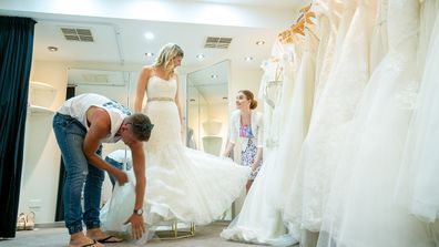 With some help, this bride tackles the tulle.