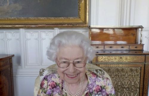 This undated video, released by Buckingham Palace on Saturday, June 4, 2022, shows Queen Elizabeth II in a video call with the winners of the Australian Awards of the Year held on the eve of the Platinum Jubilee Central Weekend in London.  (Buckingham Palace via AP)
