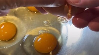 Chef Robbie Bell cracking eggs