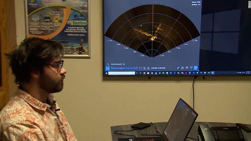 Jeff Riley of Seafloor Systems displays a sonar image of the the airplane wreckage in Folsom Lake.