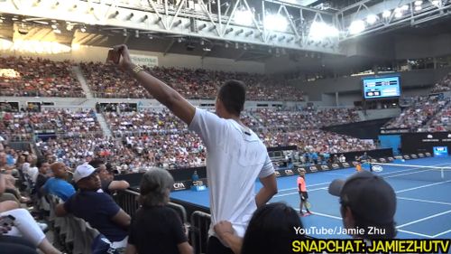 Jamie Zhu approached the edge of a stand overlooking the Melbourne Park court, pulled out his phone to film a video and began howling. (YouTube/Jamie Zhu)