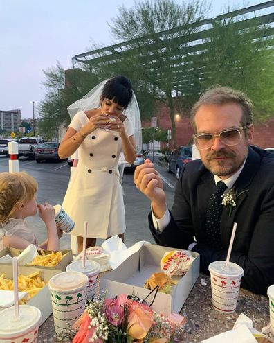 Lily Allen and David Harbour dine in a car park for their wedding reception.