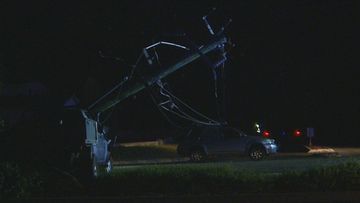 The female driver and her young son were trapped in their car under live powerlines for 30 minutes.