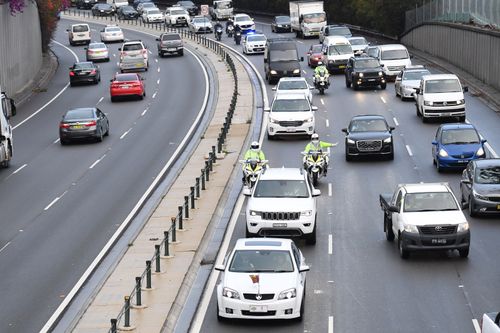 The motorcade carrying Prince Harry, the Duke of Sussex and his wife Meghan, the Duchess of Sussex, makes its way through peak-hour traffic on the Eastern Distributor in Sydney. 