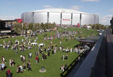 GLENDALE, ARIZONA - MARCH 17: Fans arrive at State Farm Stadium for the opening night of Taylor Swift's "The Eras" Tour on March 17, 2023 in Glendale, Arizona. (Photo by John Medina/Getty Images)