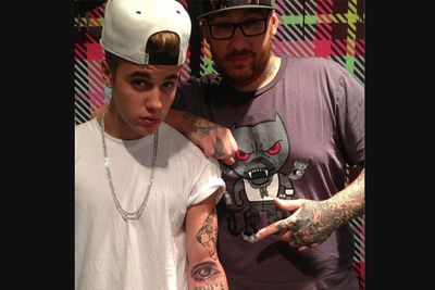 <i>Adjective</i><br/>Try-hard word that Justin Bieber uses to appear cool. It refers to an attitude of coolness. In April 2013, Justin tried his hand at tattooing, giving celeb ink artist Kevin 'Bang Bang' McCurdy the word 'swaggy' and a picture of a mouse on his leg. Bang Bang gave Justin his famous 'Believe' tattoo, and more recently, Justin's tattoo of his mother's eye on his arm. Not so swaggy after all.<br/><br/>Image: Instagram