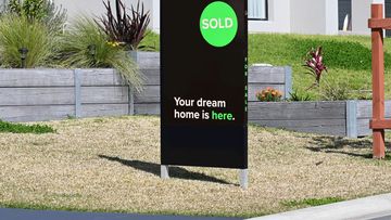 Home for sale sign with sold written on the side