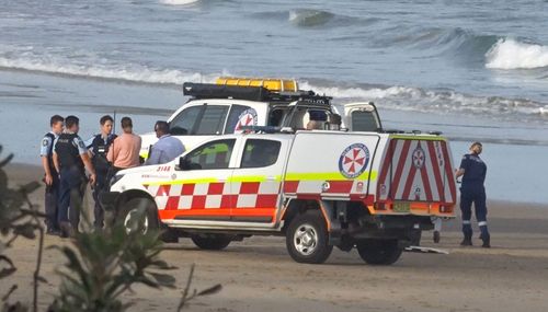 A woman has drowned after being caught in a rip at a Coffs Harbour beach.
