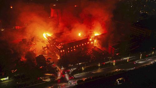 Flames come out from the residence of Nepal President Ram Chandra Poudel after it was set on fire by protesters during a protest against social media ban and corruption in Kathmandu.