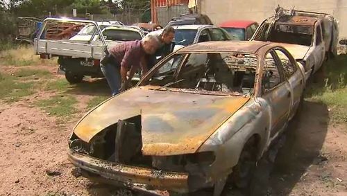 The Holden was found torched in a carpark on Trumans Road. (9NEWS)