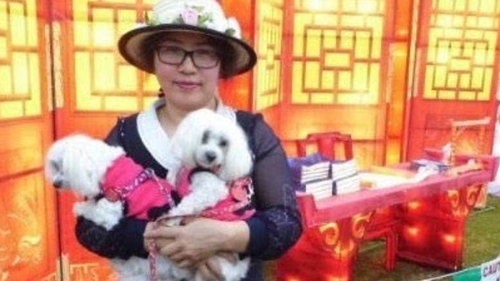 Elizabeth Zhong, pictured with her dogs Queena and DingDing.