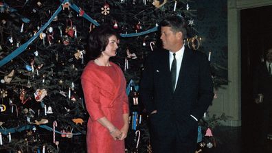 John F Kennedy and Jackie Kennedy with their 1961 White House Christmas tree.