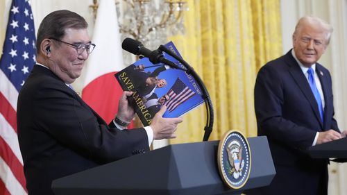 President Donald Trump and Japanese Prime Minister Shigeru Ishiba hold a news conference in the East Room of the White House.