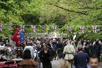 People take part in a Coronation Big Lunch in Regent's Park, London, Sunday May 7, 2023. Thousands of people across the country are celebrating the Coronation Big Lunch to mark the crowning of King Charles III and Queen Camilla