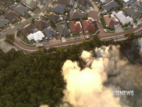 Cameras captured the fire burning dangerously close to homes yesterday afternoon. (9NEWS)