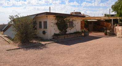 Property for sale in Coober Pedy, South Australia, with an indoor swimming pool. 