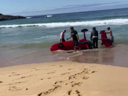 A gyrocopter has crashed while trying to alert a surfer to a shark circling nearby off the coast of New South Wales.
