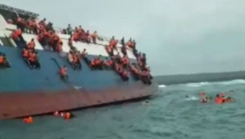 Video shows the passengers clinging to the vessel as it goes under. Picture: AP