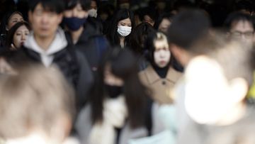 Commuters walk in a passageway during a rush hour at Shinagawa Station Wednesday, Feb. 14, 2024, in Tokyo. Japan has slipped to the worlds fourth-largest economy as government data released Thursday, Feb. 15, showed it fell behind the size of Germany&#x27;s in 2023.(AP Photo/Eugene Hoshiko)