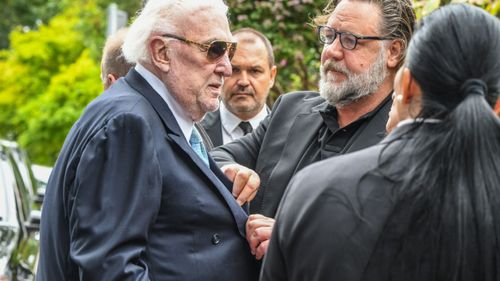 Actor Russell Crowe and John Laws at Caroline Laws' funeral.