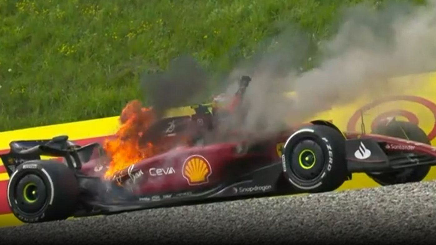 The Ferrari of Carlos Sainz catches fire during the Austrian Grand Prix.
