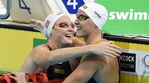 Brisbane sisters Cate and Bronte Campbell hugged after competing in the Rio Olympics trials. (AAP)