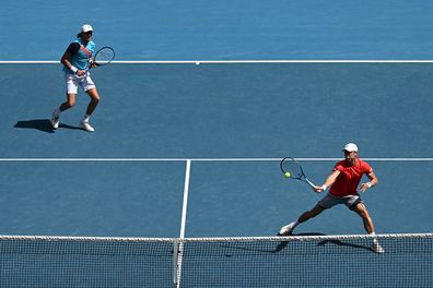 Matthew Ebden plays a forehand in his Men's Doubles Semifinals match with Max Purcell.