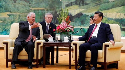 US Secretary of State Rex Tillerson, left, chats with China's President Xi Jinping during a meeting at the Great Hall of the People in Beijing on September 30. (AP)