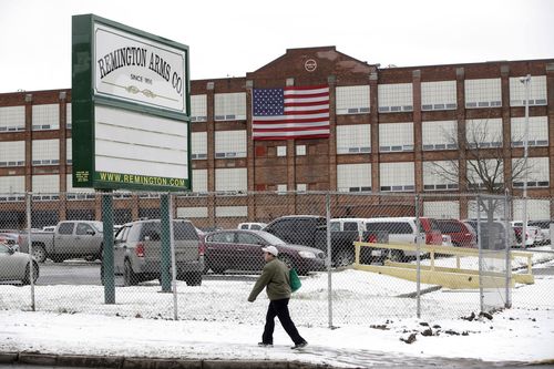 A man walks past the Remington Arms Company in Ilion, New York.