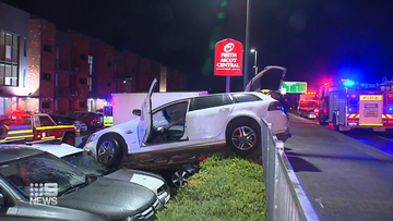 The out-of-control vehicle ploughed into the hotel carpark and landed on two parked vehicles.