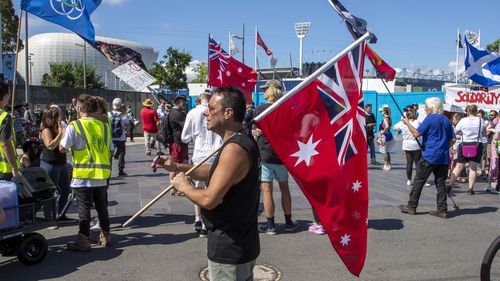 Protesters in Melbourne demanded that Novak Djokovic be allowed to play in the Australian Open. 