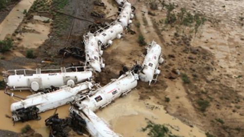 Fears derailed Queensland train is leaking acid