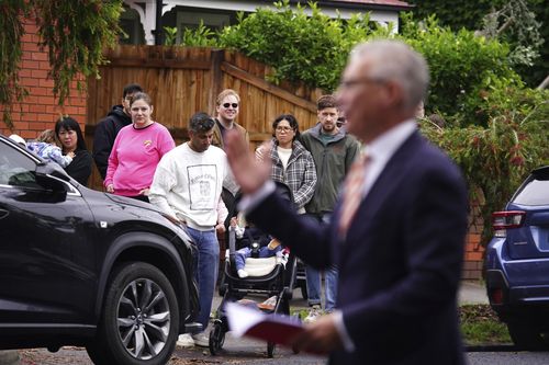 Photo of auctioneer Craig Stephens in action at 52 O'Farrell Street, Yarraville on Saturday 29 November 2025. Photo THE AGE/ LUIS ENRIQUE ASCUI