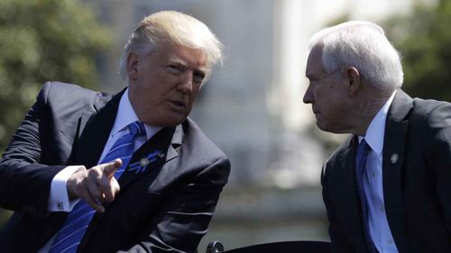 Donald Trump speaks with Jeff Sessions. (AAP)