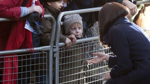 Ms Markle stopped to speak with a young girl. (AAP)