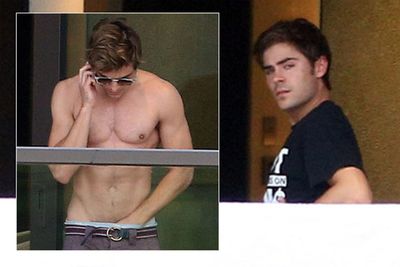 Zac Efron wasn't just caught with his hands down his pants, nosy photographers also managed to snap his bare butt through his hotel room window during a visit to Sydney.
