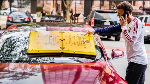 New device sticks onto car windshield until driver pays parking fine. 