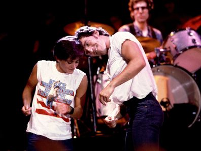 Bruce Springsteen and Courteney Cox at the filming of the video for Dancing in the Dark on 6/27/84 in Minneapolis, Mn.  (Photo by Paul Natkin/WireImage)