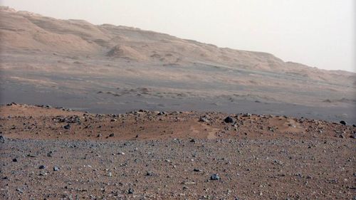 A handout photograph dated 23 August 2012 and released by NASA on 28 August 2012 a high-resolution colour picture looking south-southwest from the rover's landing site on planet Mars. (AAP)