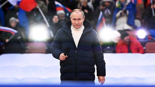 Russian President Vladimir Putin delivers his speech at the concert marking the eighth anniversary of the referendum on the state status of Crimea and Sevastopol and its reunification with Russia, in Moscow, Russia, Friday, March 18, 2022.