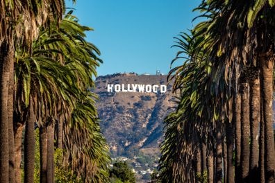 19 october 2018 - Los Angeles, California. USA: Hollywood Sign between Palm trees from central Los Angeles