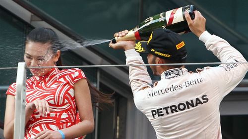 Podium hostess sprayed with champagne by Lewis Hamilton speaks out