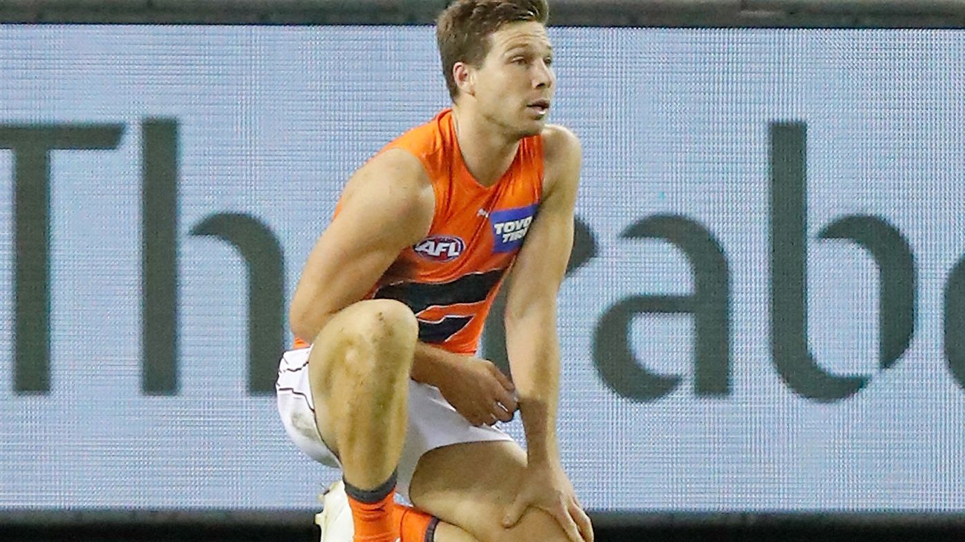 Toby Greene of the Giants is seen after injuring his shoulder
