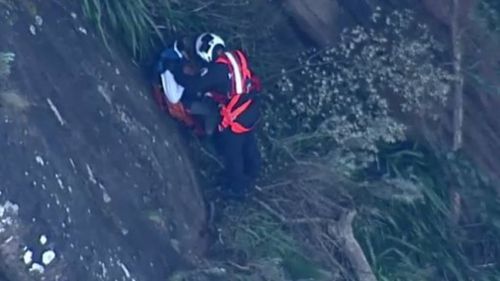 Emergency services work to rescue one of two boys. 